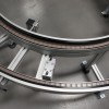 Curve pallet conveyor system with pneumatic locate.